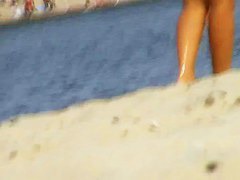 Voyeur preys on a juicy ass on the nudist beach
