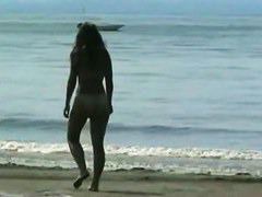 A naked blonde and a golden haired beauty in a beach porno vid
