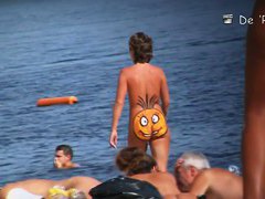 A nude beach voyeur films a funny girl with a pineapple painted on her ass