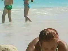 Candid beach camera is capturing hot tanned boobies