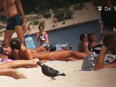 Beach nudist girls show asses and tits to the beach crowd