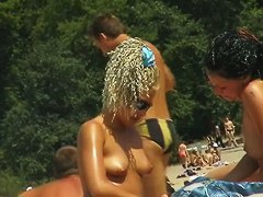 Beach voyeur gets his spy cam in action for a nudist shot