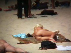 Blonde kinky girl is so sexy looking on this beach