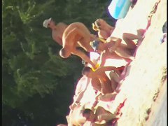 Naked tourists caught on beach spy cam relaxing and enjoying nudity