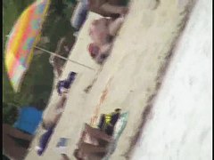 Naked tourists caught on beach spy cam relaxing and enjoying nudity