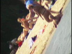 Naked tourists caught on beach spy cam relaxing and enjoying nudity