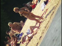 Naked tourists caught on beach spy cam relaxing and enjoying nudity
