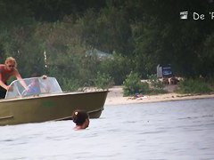 Hot nudist woman captured by a hidden beach camera