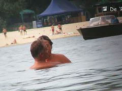 Hot nudist woman captured by a hidden beach camera