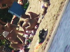 Hot naked red hair chick on nude beach spy camera