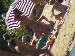 Hot naked red hair chick on nude beach spy camera