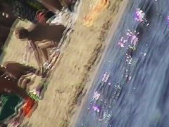 Hot naked red hair chick on nude beach spy camera