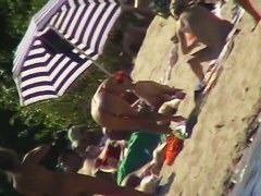 Hot naked red hair chick on nude beach spy camera
