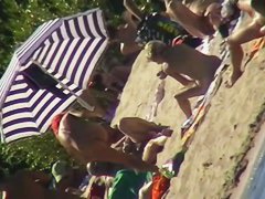 Hot naked red hair chick on nude beach spy camera
