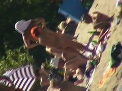 Hot naked red hair chick on nude beach spy camera