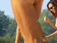 One topless and one pantieless babe on beach spy cam