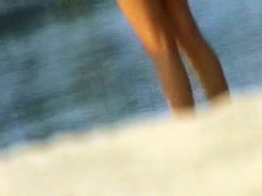 One topless and one pantieless babe on beach spy cam