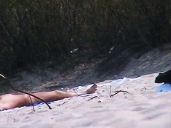 One topless and one pantieless babe on beach spy cam