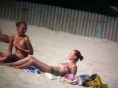 Porno of thin nude chicks on a nudist beach relaxing and talking