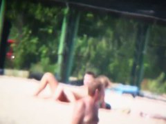 Porno of thin nude chicks on a nudist beach relaxing and talking