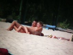 Porno of thin nude chicks on a nudist beach relaxing and talking