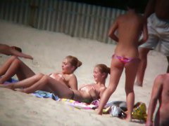 Porno of thin nude chicks on a nudist beach relaxing and talking