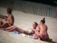 Porno of thin nude chicks on a nudist beach relaxing and talking