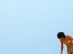 Topless sleek hotties on the nude beach getting filmed by a voyeur