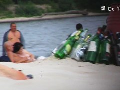 Naked beauty is dreaming on beach on the voyeur camera