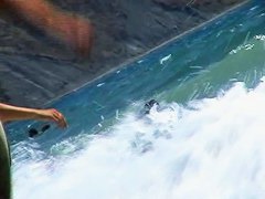 Short-haired girl with trimmed pussy relaxing at the nudist beach