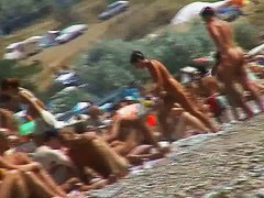 Short-haired girl with trimmed pussy relaxing at the nudist beach