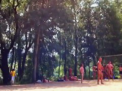 Candid camera rolling on an unsuspecting nudist beach