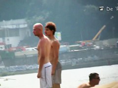 Topless beauty in tiny thong on beach voyeur camera