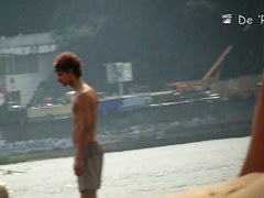 Topless beauty in tiny thong on beach voyeur camera