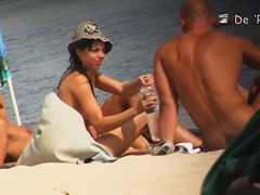 Mature bimbos get their panties in voyeur nudist beach video