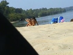 Two hot candid beach babes naked in the sun