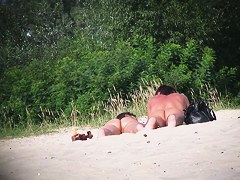 Hot couple of beach nudists voyeured on spycam from behind
