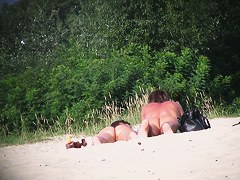 Hot couple of beach nudists voyeured on spycam from behind