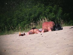Hot couple of beach nudists voyeured on spycam from behind