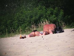 Hot couple of beach nudists voyeured on spycam from behind