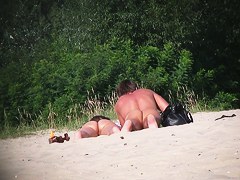 Hot couple of beach nudists voyeured on spycam from behind
