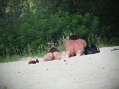 Hot couple of beach nudists voyeured on spycam from behind