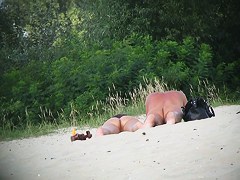 Hot couple of beach nudists voyeured on spycam from behind
