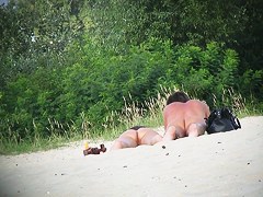 Hot couple of beach nudists voyeured on spycam from behind