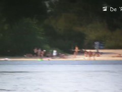two babes on the beach playing with each other in the sea