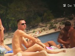 two babes on the beach playing with each other in the sea