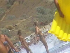 Real beach voyeur video of hot nudist chicks showing off their bodies by the water
