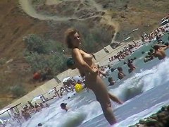 Real beach voyeur video of hot nudist chicks showing off their bodies by the water