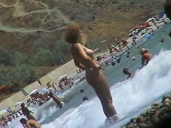 Real beach voyeur video of hot nudist chicks showing off their bodies by the water