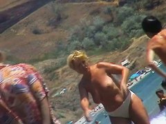 Real beach voyeur video of hot nudist chicks showing off their bodies by the water